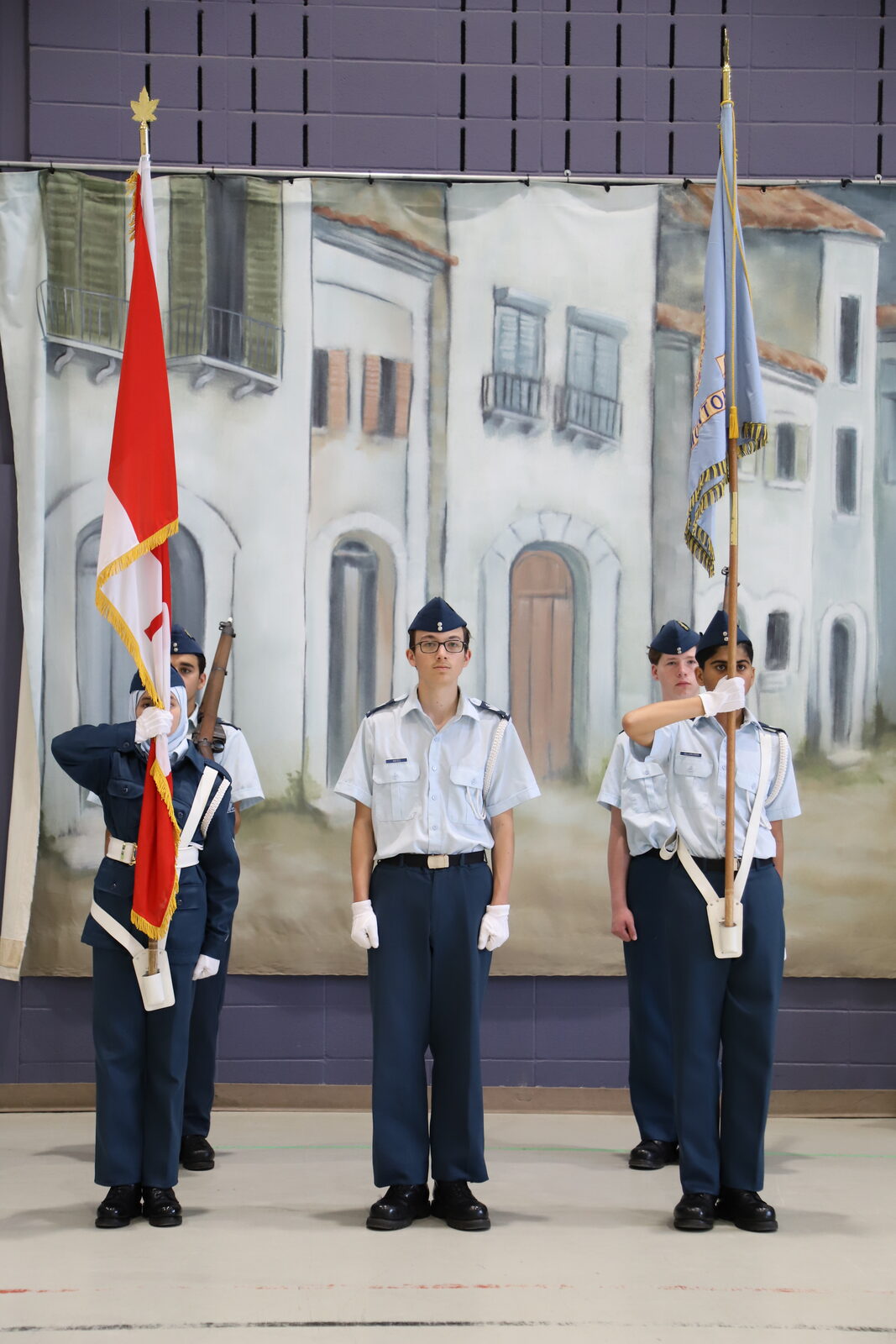 Cadets of the 12 Edmonton colour party holding the Canadian flag and the squadron pennant